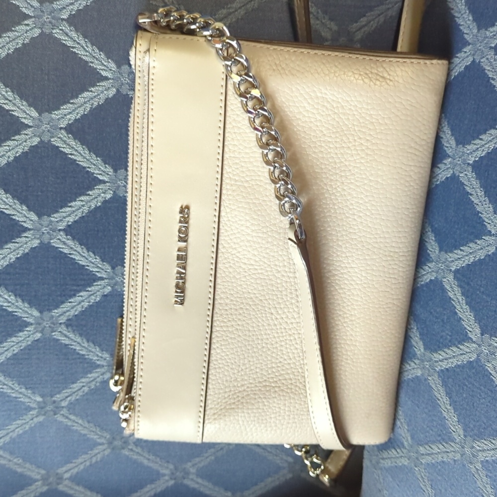 Michael Kors gray cross body bag, two zippered compartments and wallet center